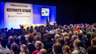  Infosecurity Europe attendees watch a speaker at the Keynote Stage