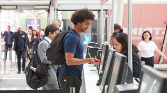 Man Checks in at Infosecurity Europe Registration Desks at ExCeL London