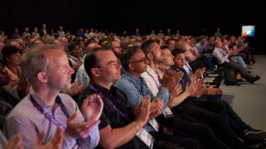 Information Security professionals clap during an Infosecurity Europe Keynote presentation