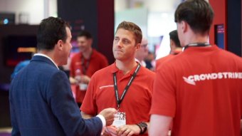 ExCeL London exhibition centre during Infosecurity Europe with Crowdstrike exhibitor branding banner