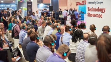 Infosecurity Europe visitors listen to a Technology Showcase session with headsets