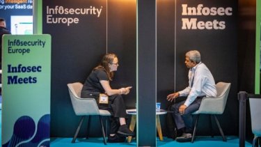 Infosecurity Europe attendee and exhibitor in a meeting