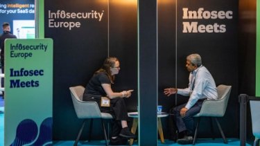 Two attendees at Infosec Meets