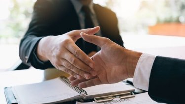 Two men handshaking