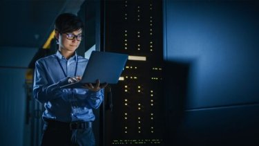 Woman holding a laptop